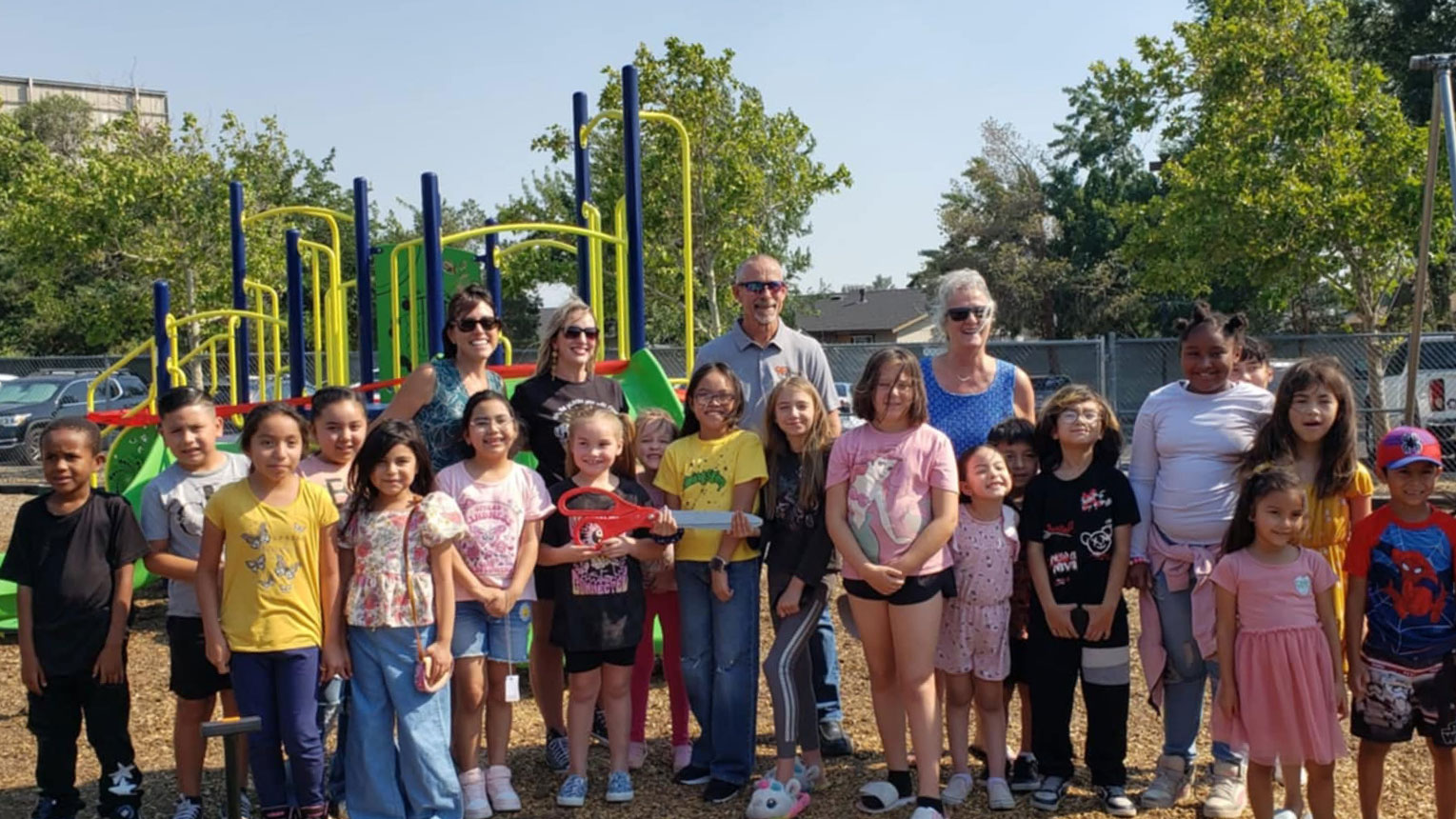 about-us-banner Students standing in front of a playground